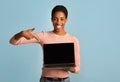 Great Website. Happy Beautiful African Lady Pointing At Laptop With Black Screen