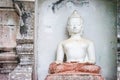 Great white Buddha statue with old background wall Royalty Free Stock Photo