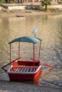Great White Egret and small boat at Huacachina Oasis - Ica, Peru