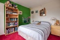 Traditional furnished bedroom with green wall