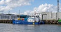 A commercial offshore crew transfer vessel moored on the River Yare in the seaside town of Great Yarmouth