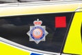 Greater Manchester Police badge on a car window Royalty Free Stock Photo