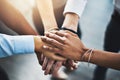 Greatness derives from committed teams. Closeup shot of a group of businesspeople joining their hands together in a Royalty Free Stock Photo