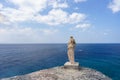 Grecian statue on cliff side in Fortune island