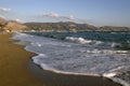 Grecija beach at a sunny day, with sand beach and blue sea. Vacation in the Grecija.