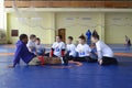 Greco-Roman wrestler Zhan Beleniuk, winner of 2016 Olympics, communicating with children talking of wrestling. National