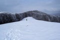 Grecul peak toward Leuca Mica peak. Winter landscape between Azuga and Grecului valley towards Gura Diham chalet Royalty Free Stock Photo