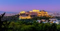 Greece - The Acropolis of Athens, Greece, with the Parthenon Temple with lights during sunset. Athens, Greece, Europe