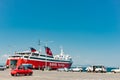 Greece, Aegina - 23 June, 2019 Red ferry Nova Ferries in Aegina port, sunny day