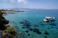 Greece, Angistri, near Athens. A pleasure boat moored by the coast.