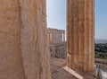 On Acropolis hill, view between columns to the small Ionian style Athena Nike victorious ancient temple