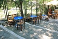 Empty chairs and tables of a traditional restaurant in Athens, Greece Royalty Free Stock Photo