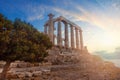 Greece. Cape Sounion - Ruins of an ancient Greek temple of Poseidon with sunset sky clouds Royalty Free Stock Photo