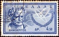 GREECE - CIRCA 1961: A stamp printed in Greece shows ancient Greek philosopher Democritus, circa 1961.