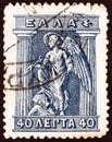 GREECE - CIRCA 1911: A stamp printed in Greece shows Iris the personification of the rainbow and messenger of the gods