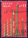 GREECE - CIRCA 1975: A stamp printed in Greece shows various wind instruments, circa 1975. Royalty Free Stock Photo