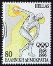 GREECE - CIRCA 1996: A stamp printed in Greece from the `Modern Olympic games centenary` issue shows discus throw, circa 1996. Royalty Free Stock Photo