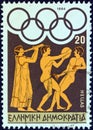 GREECE - CIRCA 1984: A stamp printed in Greece shows flute player, discus thrower and long jumper