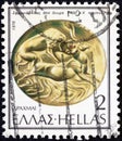 GREECE - CIRCA 1976: A stamp printed in Greece shows lion attacking bull, onyx, 14th century BC, circa 1976.