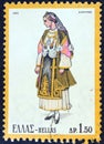 GREECE - CIRCA 1973: A stamp printed in Greece shows a woman from Almyros, Thessaly, circa 1973. Royalty Free Stock Photo