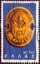 GREECE - CIRCA 1963: A stamp printed in Greece from the `11th World Scout Jamboree, Marathon` issue shows Jamboree Badge