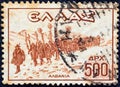 GREECE - CIRCA 1946: A stamp printed in Greece shows Greek infantry column marching in Albania, circa 1946.