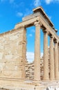 Greece. Colonnade of the Erechtheion temple in the ancient Athenian Acropolis against the blue sky Royalty Free Stock Photo