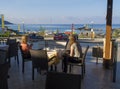 Greece, corfu, Agios Georgios, september 26, 2018: Two woman, mother and daugter having breakfast at outdoor hotel terrace restaur