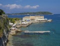 Greece, corfu, Kerkyra town, september 26, 2018: Faliraki beach Alecos Baths public bathing spot with rock and pier ans the En plo