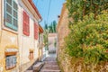 View of an alley in Sinarades on Corfu in Greece Royalty Free Stock Photo