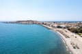 Greece Crete, pebble beach Paleochora town. Aerial drone panoramic view of crystal clear sea water