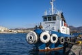 Old tugboat on the pier in the Aegean Sea on Crete