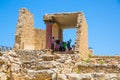 Greece, Crete. Tourists visiting the Knossos ruins, ceremonial and political centre of the tsar Minos. Royalty Free Stock Photo