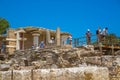 Greece, Crete. Tourists visiting the Knossos ruins, ceremonial and political centre of the tsar Minos. Royalty Free Stock Photo