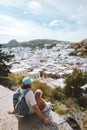 Greece family vacations man with child sightseeing Lindos city aerial view travel lifestyle