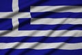 Greece flag is depicted on a sports cloth fabric with many folds. Sport team banner Royalty Free Stock Photo