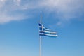 Greece flag is flying in air on blue sky background. Banner, place for text Royalty Free Stock Photo