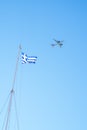 Greece flag and a flying plane in the sky. Concept vacation and tourism