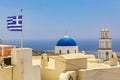Greece flag over Greek old town on Santorini island. Royalty Free Stock Photo