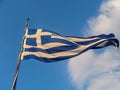 Greece Flag waving on blue sky background Royalty Free Stock Photo