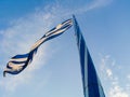 Greece Flag waving on blue sky background Royalty Free Stock Photo