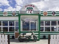 Greece, June 2020: a Retro motorcycle stands at the entrance to the American-style Diner 72 biker bar in Greece