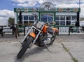 Greece, June 2020: a Yamaha Drag Star Motorcycle stands at the entrance to the American-style diner 72 biker bar in Greece