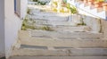 Greece, Kea island. Ioulis city narrow street with stairs and traditional buildings Royalty Free Stock Photo