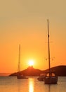 Greece, Kea island. Sailing boats at sunset, sunrise. Vertical photo