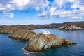 Greece, Kea Tzia island. Lighthouse on rocky cape, sky, sea background