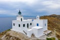 Greece, Kea Tzia island. Lighthouse on rocky cape, sky, sea background