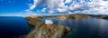 Greece, Kea Tzia island. Lighthouse on rocky cape, sky, sea background. Panorama