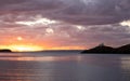 Greece, Kea Tzia island. Lighthouse on rocky cape, sky, sea background