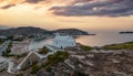 Greece, Kea Tzia island. Small white church on a rocky hill, over Korissia port at sunset Royalty Free Stock Photo